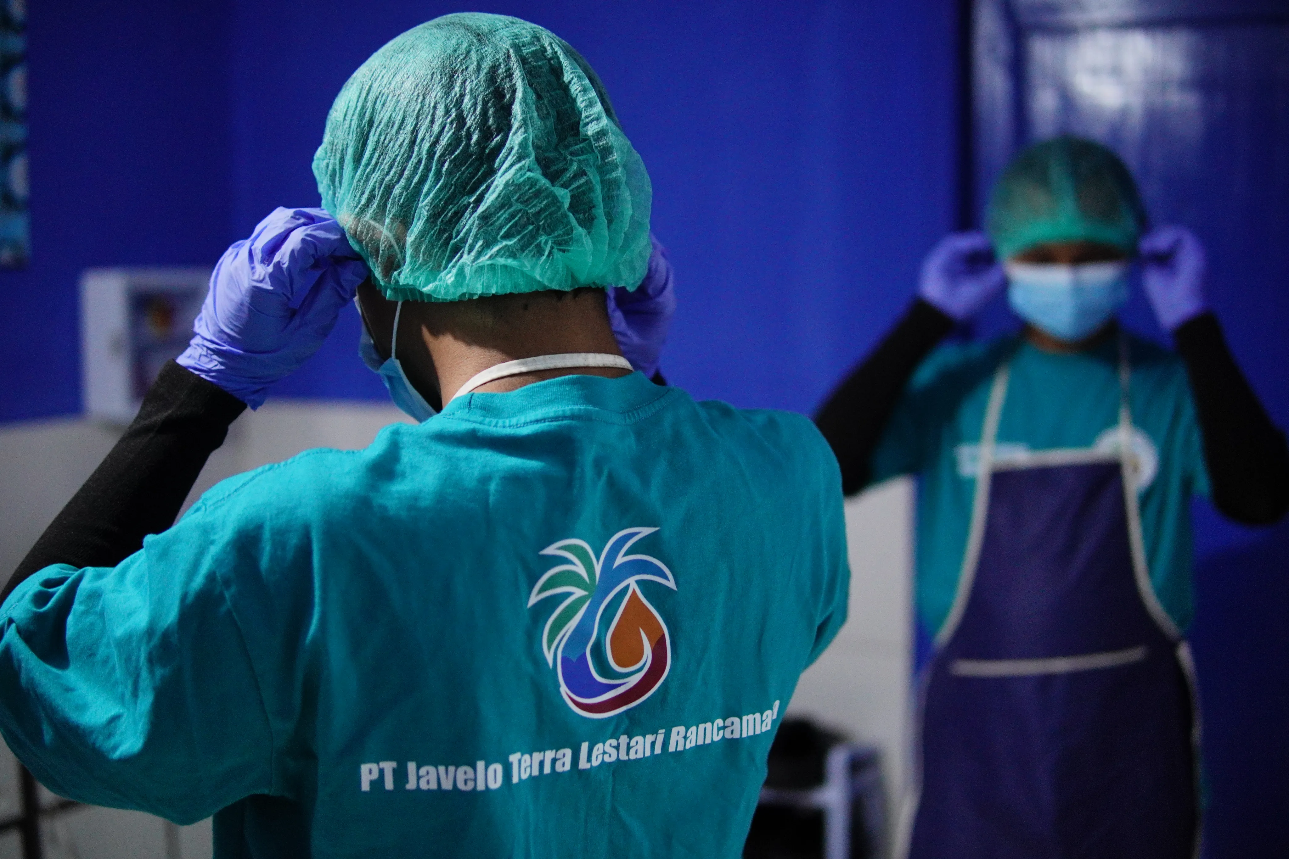 Javelo Terra Lestari worker outside the processing facility